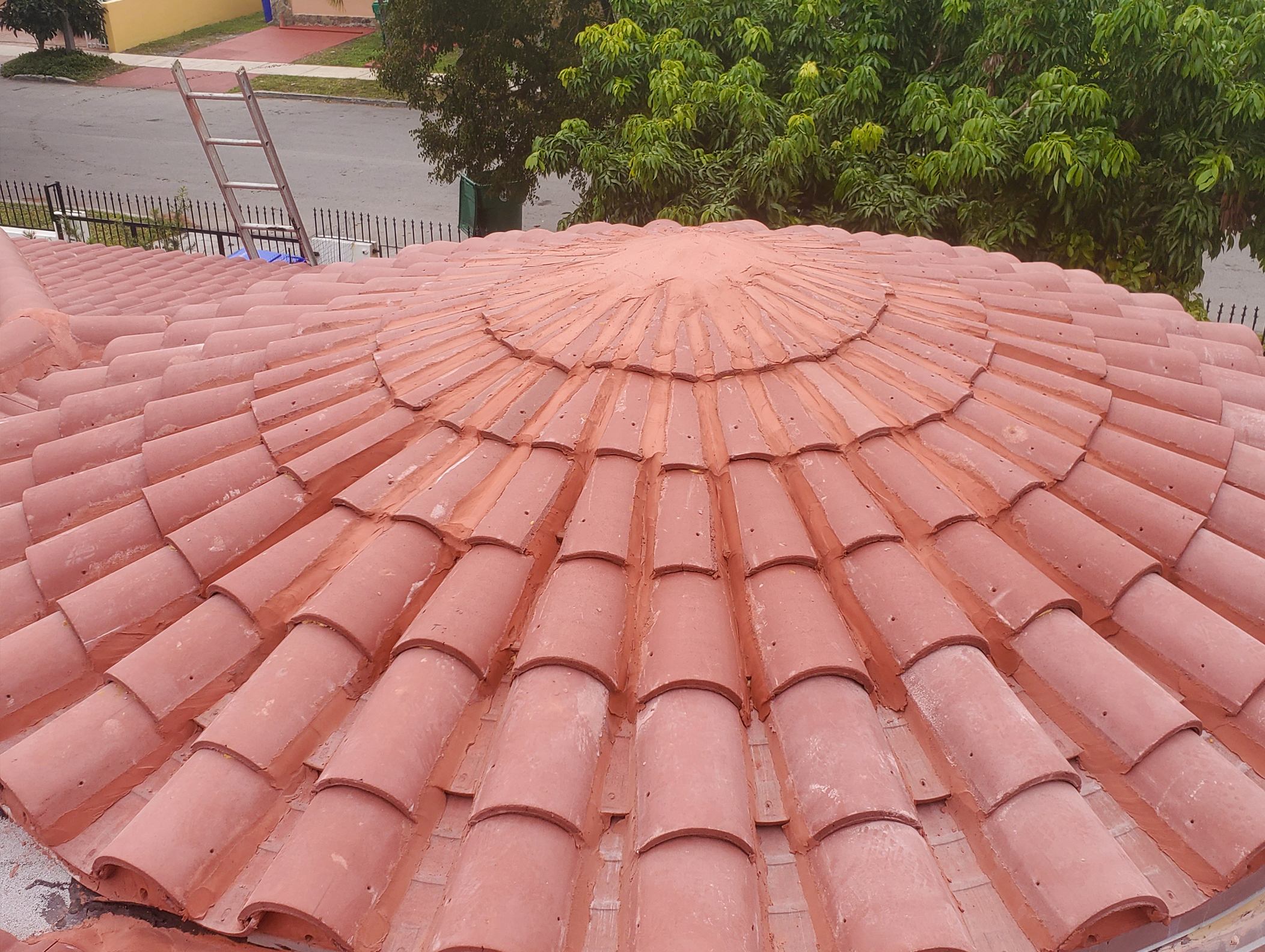 Top of a red Spanish tile roof.