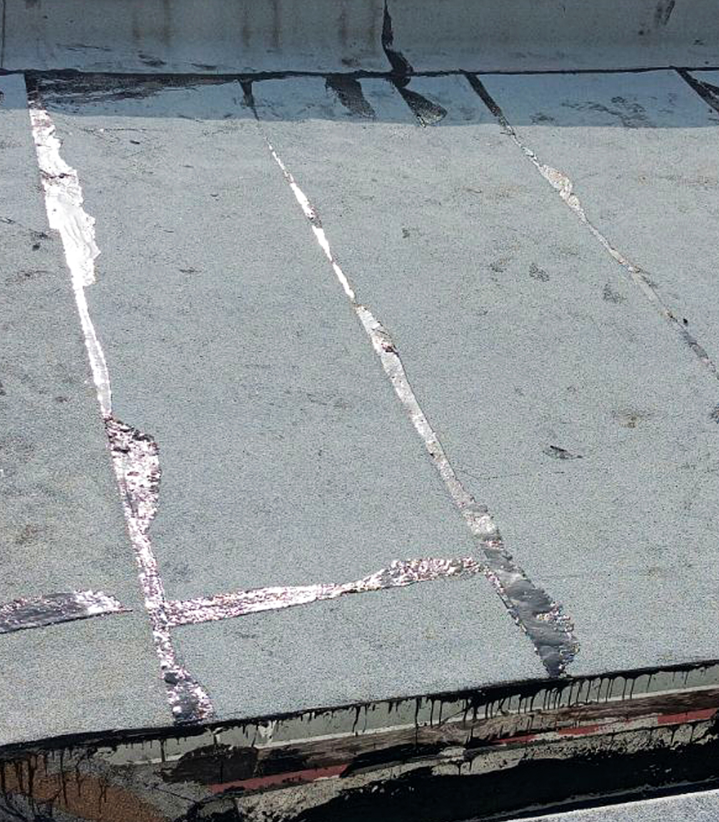 Cropped photo of an industrial roof repaired.